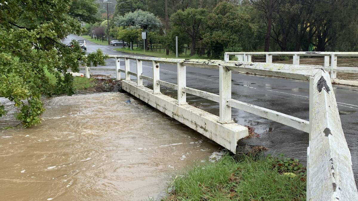 Mittagong Creek nearly overflowing on Shepherd Street, caution issued for drivers