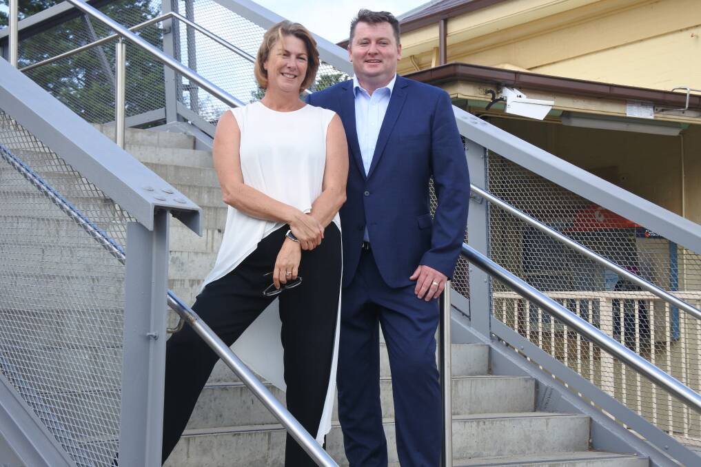 NSW Minister for Roads, Maritime and Freight, Melinda Pavey and Liberal Candidate for Wollondilly, Nathaniel Smith on the steps of Mittagong Station.