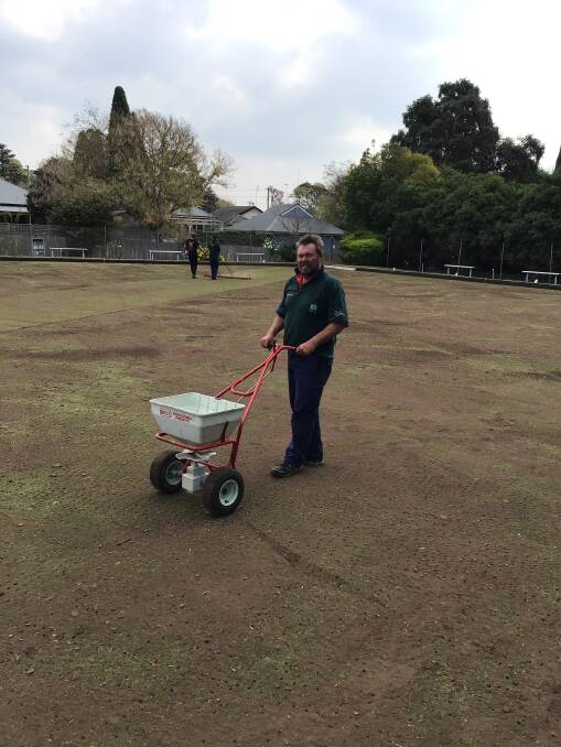 THE MAN WITH THE GREEN THUMB: Josh Woodcock working on renovations at the Bowral Bowling Club.