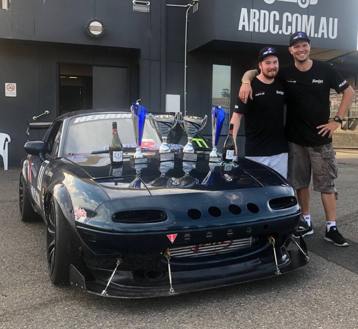 TURN AND BURN: Andy Harris and Todd Herring celebrating their win in the Sydney 300 at the Sydney Motor Way at Eastern Creek.