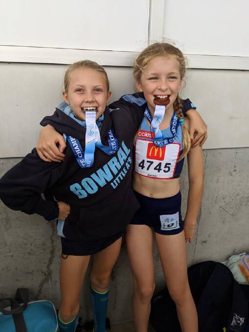 Ruby Blake and Pearl Stravoskoufis enjoying a successful State athletics carnival in Sydney.