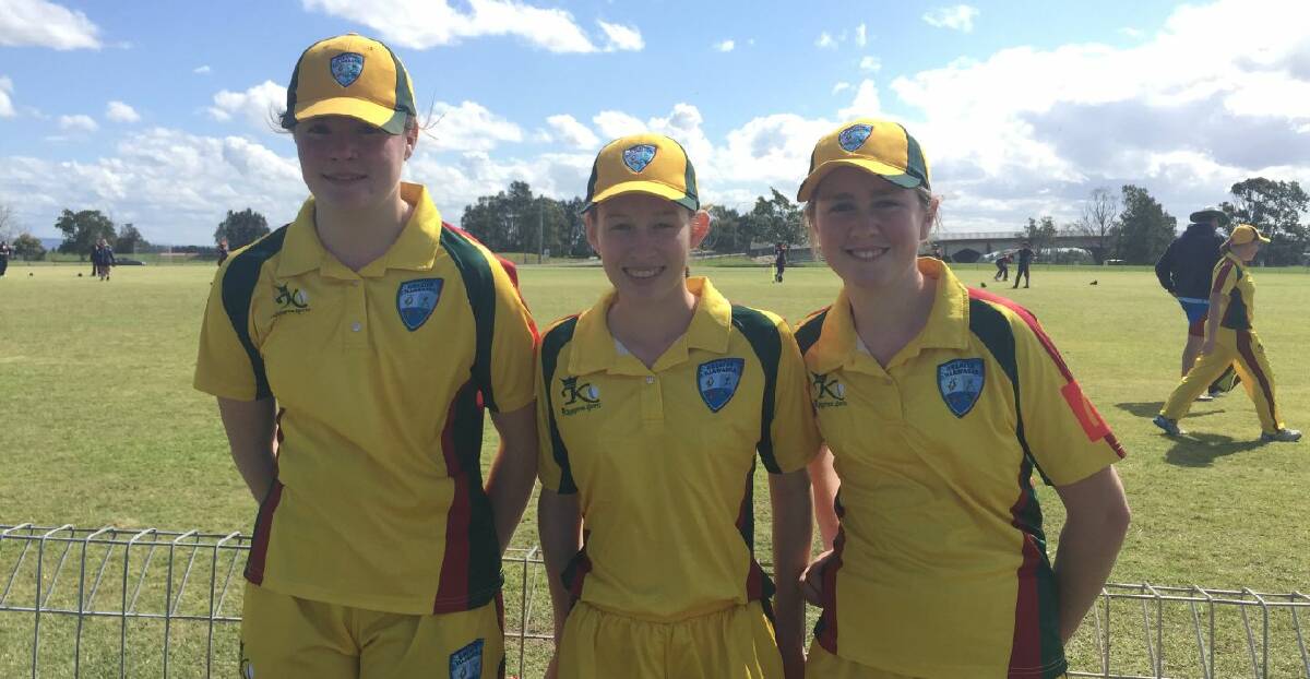 GO THE BLUES: Hilary Swan, Caitlin Appleyard and Annalee Watson representing the Bowral Blues Cricket Club proudly. 