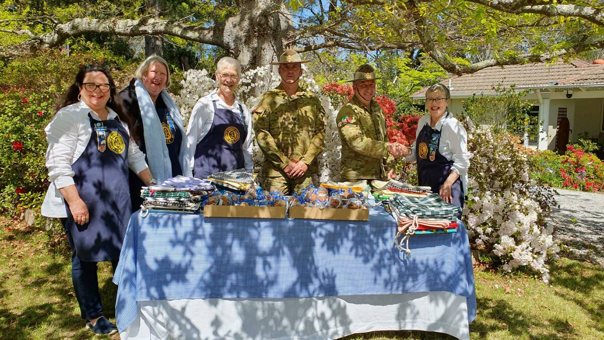 Army members take delivery of gifts from some of the Moss Vale Evening CWA branch members. Photo supplied