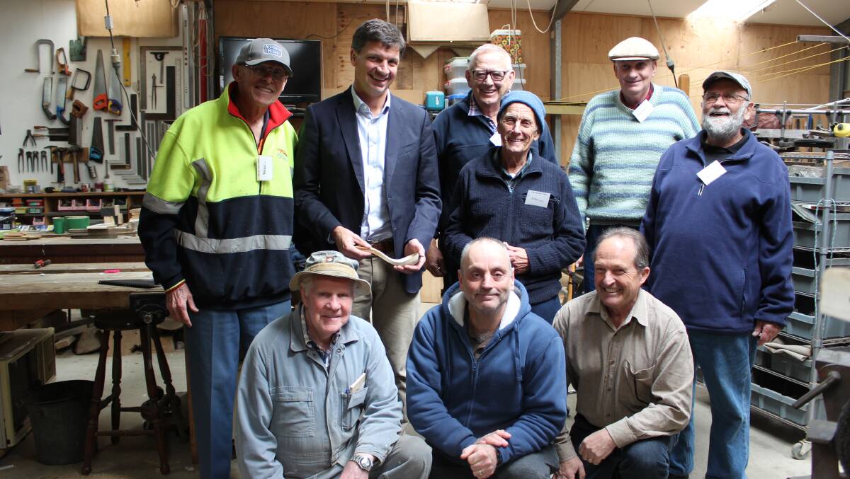 Angus Taylor with members from Hill Top Men’s Shed. They will use a $2749 grant to improve safety in their new headquarters which will open soon. Photo: supplied