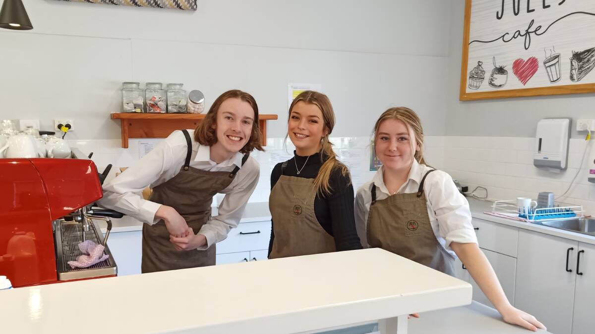 Year 12 students get ready to serve others in the school cafe. Photo supplied