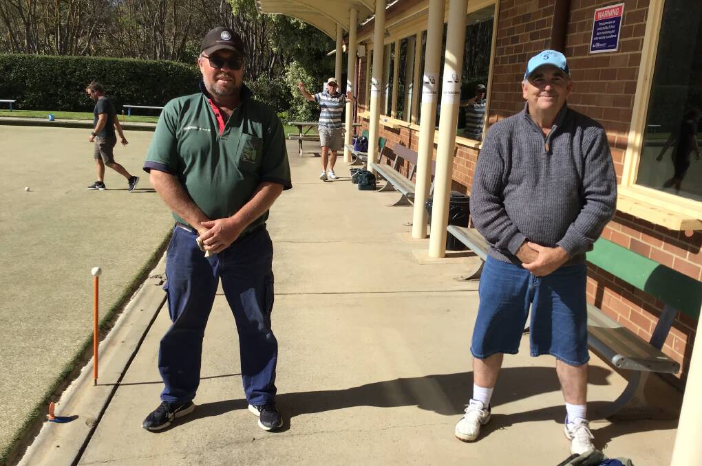 Josh Woodcock (left) and Mick Armstrong continue to hone their skills on the green at Bowral Bowling Club. Photo supplied
