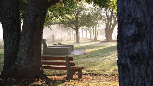 A soft golden fog at the National Service and Reserve Forces memorial set the scene for the morning Anzac Day service at Sutton Forest at Golden Reserve . Picture Vera Demertzis