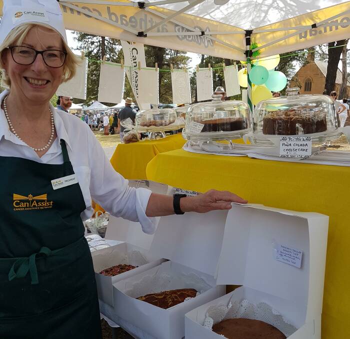 Jenny Harper at a Can Assist fundraising cake stall earlier this year. Photo supplied