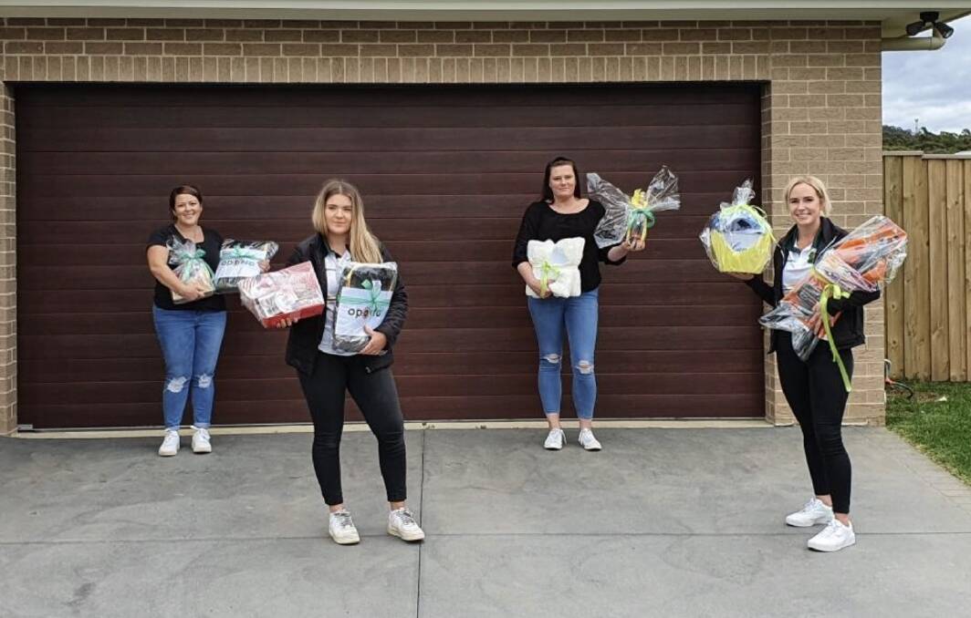 From left Catherine Mackey club secretary, Brittany Kelly ladies' league player,
Cindy Wood club treasurer, Brooke Meadows ladies' league player and owner of Be Fit by Brooke with some of the donated prizes in the Mittagong Senior Lions Rugby League Club Mothers' Day raffle.