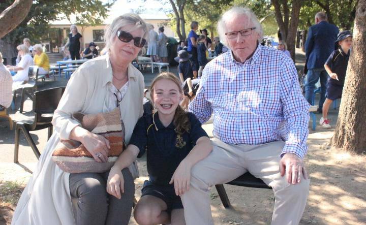 Maddy with her grandparents Gary and Maree Garton at Oxley College in April 2018.