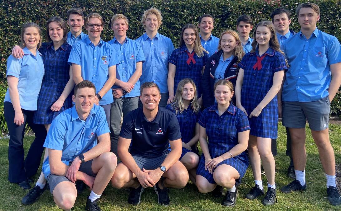 Head teacher of PDHPE Luke Vandenbergh is pictured with the Year 12 PDHPE class of 2020. Photo supplied