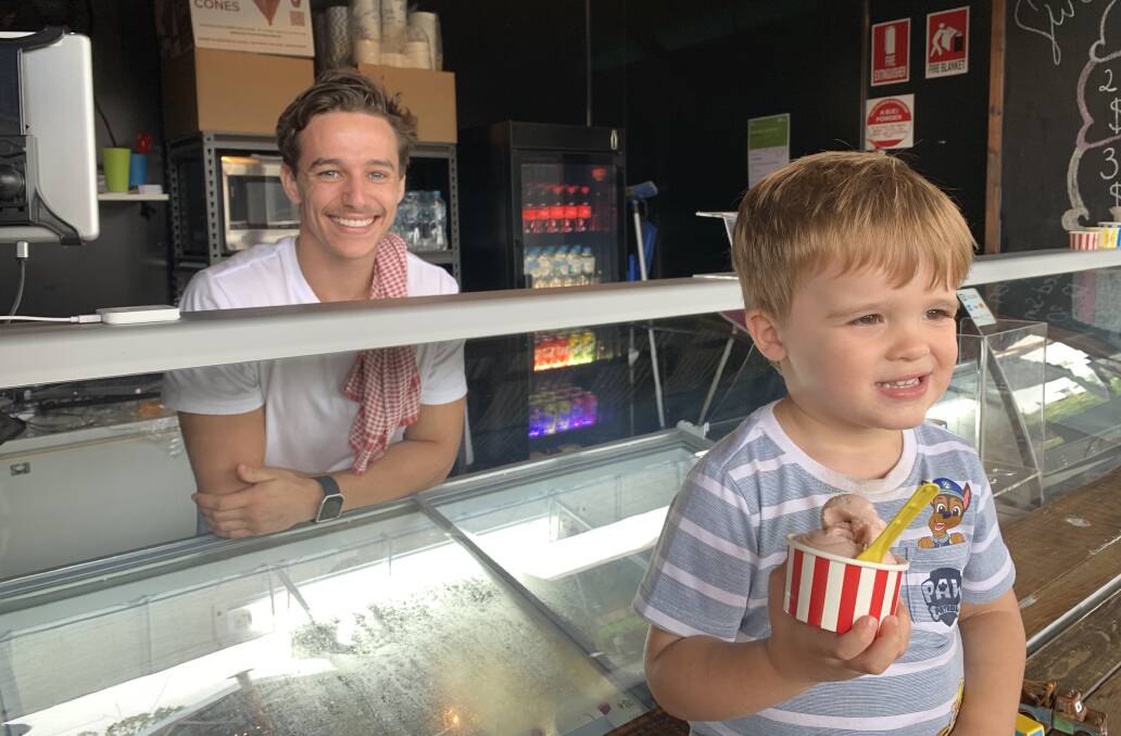 Henry Green, 3, gets set to tuck into a cool sweet treat served by Declan Veness from Sweet Retreat Gelato.