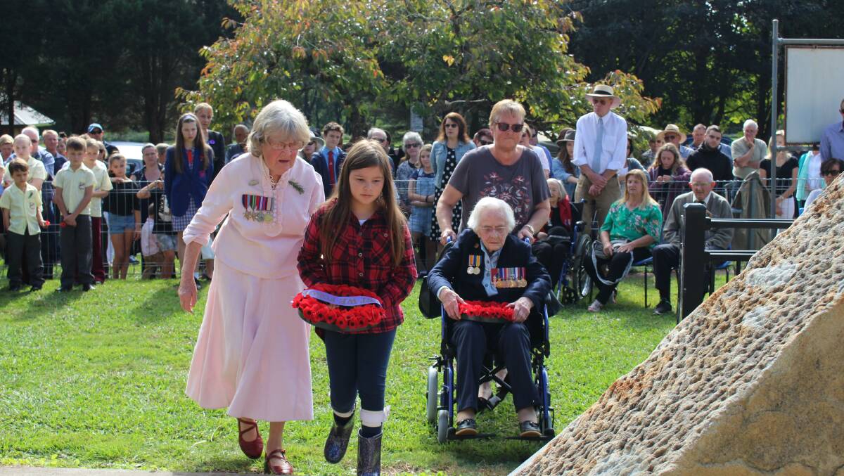 Four generations of women gathered at the main Anzac Day service in Robertson to lay a wreath of poppies. Photo Vera Demertzis
