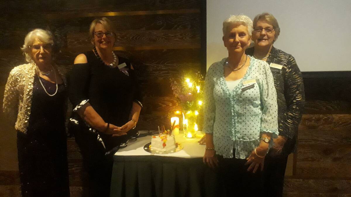 President Jan Scott, Zone Councillor Deborah Chivers, National Councillor Joanne Gray and Past National President Gwen Wilton cutting the cake for Southern Highlands Evening VIEW Club 43rd birthday