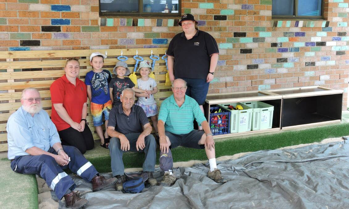 Peter Costigan Hill Top Men's Shed president is pictured left with Abby James (Bunnings Mittagong) children Alyrah, Kaleb and Logan, staff member Emily and Men's Shed members John Matters and Robert Ellis.