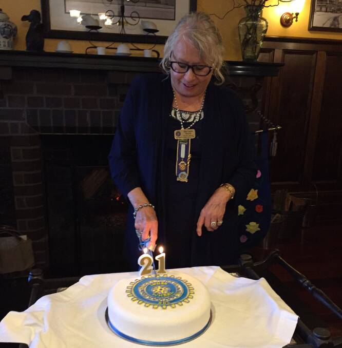 Innerwheel Southern Highland founding member Barbara Smith cuts the club's 21st birthday cake. Photo: supplied