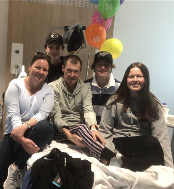 Scott celebrates his 50th birthday in hospital with his family. Photos supplied