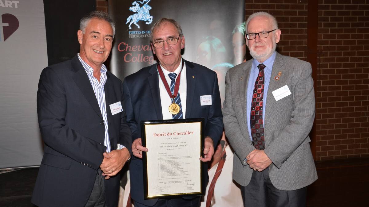The Hon John Fahey AC receiving his Esprit du Chevalier Medal from Dick Simpson and Chevalier principal Chris McDermott. Photo supplied
