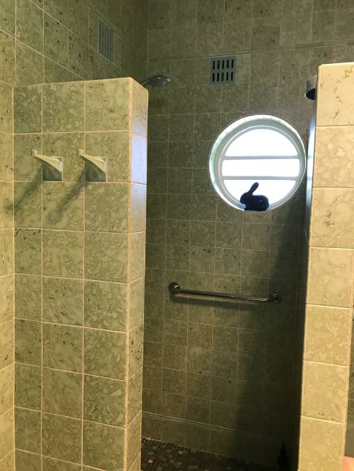 A porthole window in the shower continues the circle theme and connectivity embedded in the property built in 1949. The original tiles are still a feature of both bathrooms.
