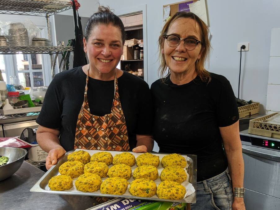 ADAPTATION: Karen Miller and Lucinda Dazos of Lucinda's Pantry at Robertson, NSW. Take away dinner supplies and home delivery are replacing the usual room full of coffee drinkers and locals who lunch. Photo by Sonja Fernando