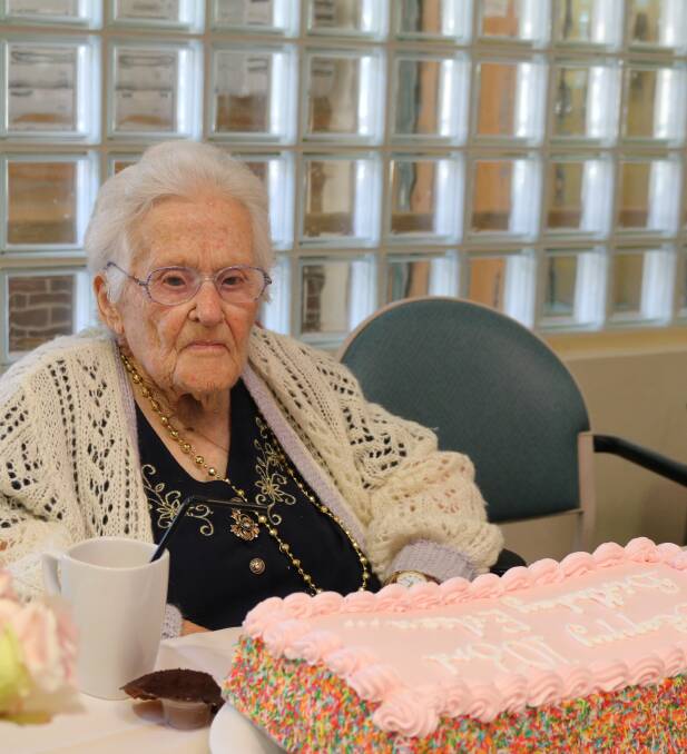 Birthday girl: Eileen Veal prepares to cut her 103rd birthday cake. Photos: supplied