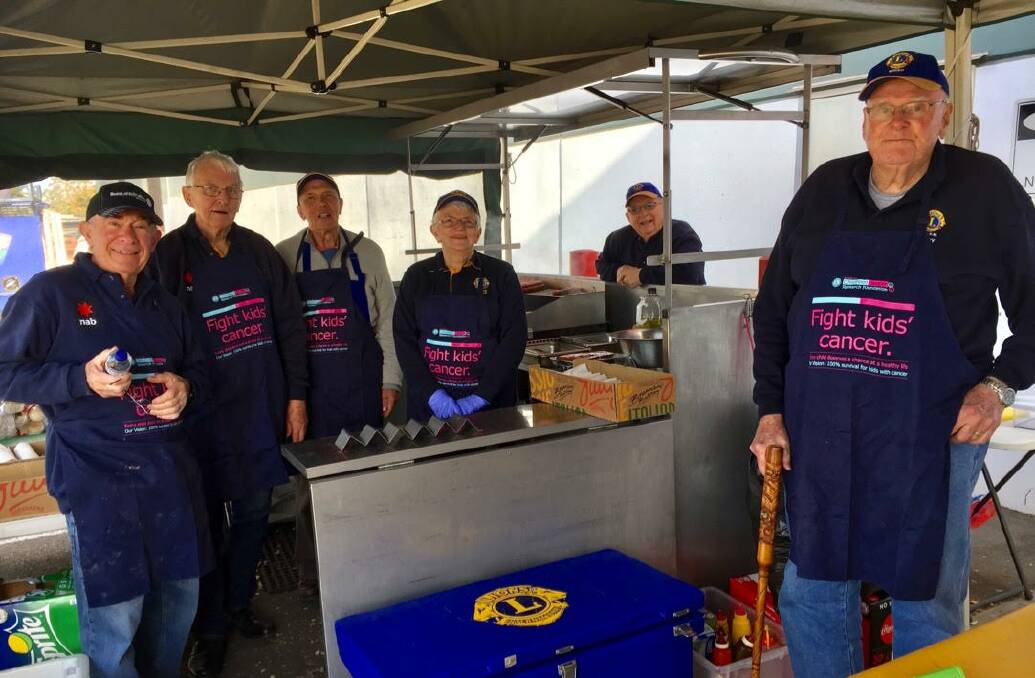 Lions Bill Bransom, Roger Humphrey, Steve Westwood, Wendy Lane, president Nick Marshall and Terry Lane cook up tasty treats for charity. Missing volunteers Tom Dolan (secretary) and Bob Short. Photo supplied
