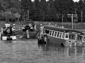 DISASTER AVERTED: At Bong Bong Bridge on July 22, 1959, getting ready to pull the stranded bus out of floodwater. Photo: BDH&FHS