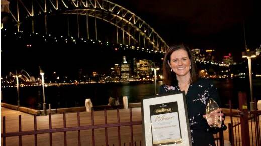 Carley Pridham accepts the award on behalf of her parents Brett and Sue Funnell for 2018 Best Inland Caravan Park. Photo: supplied