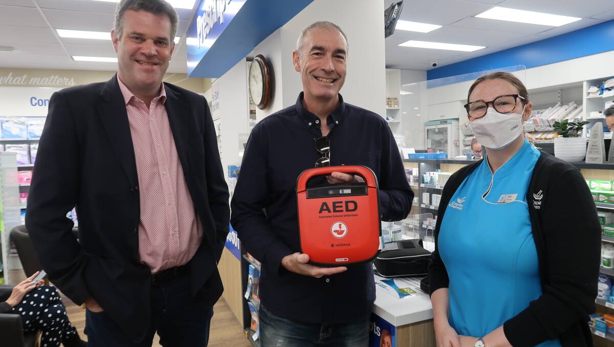 Matt Sewell from BDCU, original yellow wiggle Greg Page and Capital Chemist store manager Emily. AED's can increase the chance of surviving a cardiac arrest by 70 per cent.