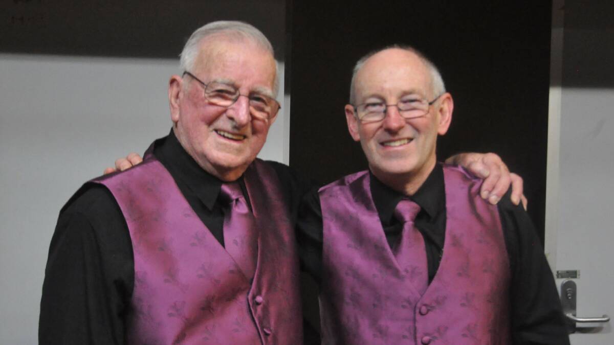 A photo of Alan Soden with fellow Lydian Singer, Taff Hughes in their Lydian Singers uniform.