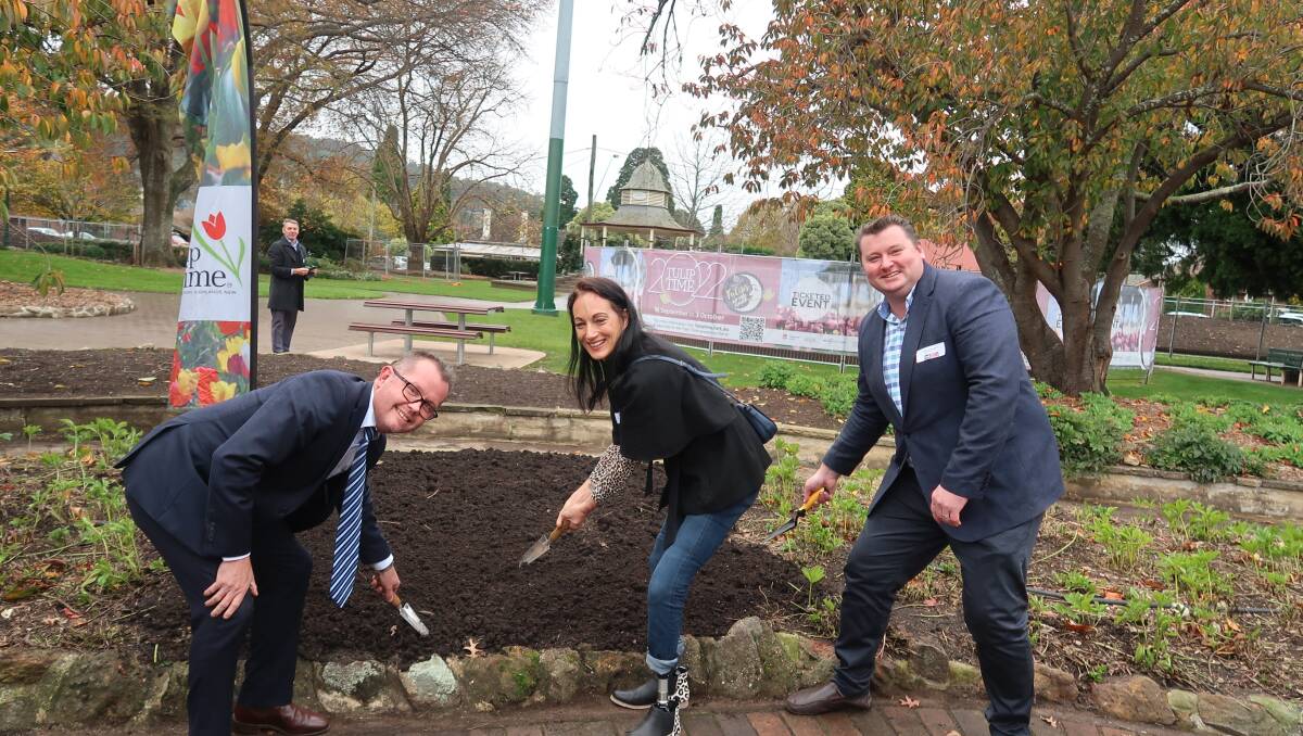 Eliza Stankovic Mowle planted the first tulip time bulb. Zac Hulm from Harbison and Wollondilly MP Nathaniel Smith also planted a bulb each. Picture: Vera Demertzis.