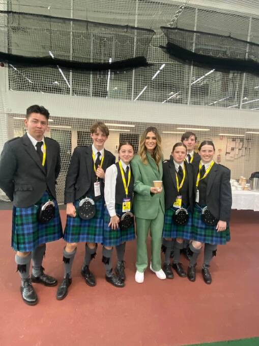 The pipe band also got to meet Delta Goodrem. Picture supplied.