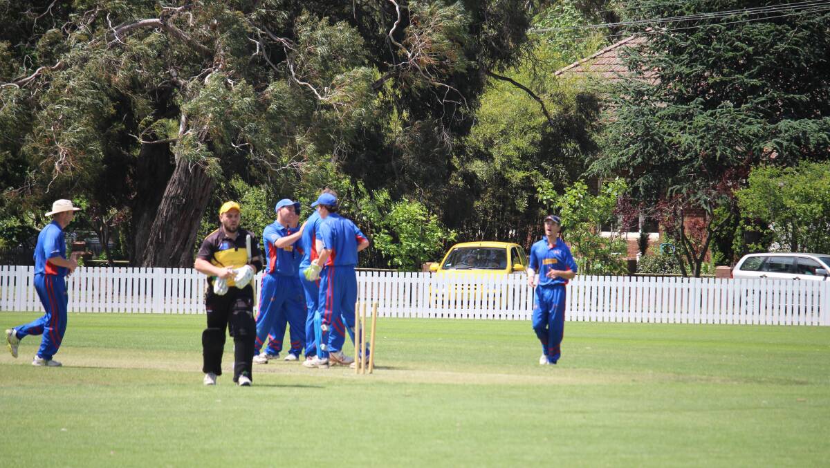 First Grade: The Bowral boys celebrated in the 17th over as the bowled out Simon Reid from Hill Top Northern Villages Cricket Club. Photo: Vera Demertzis