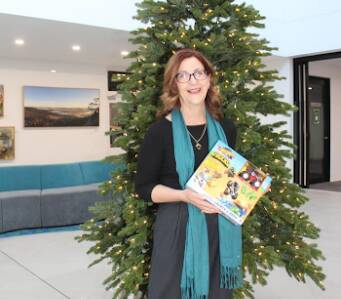 Wingecarribee Shire Council general manager Lisa Miscamble in front of this year's giving tree located in the Moss Vale Civic Centre. Picture: supplied.
