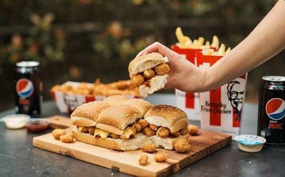 KFC launches The Slab, a six pack of classic dinner rolls filled with popcorn chicken and more. Photo: supplied.