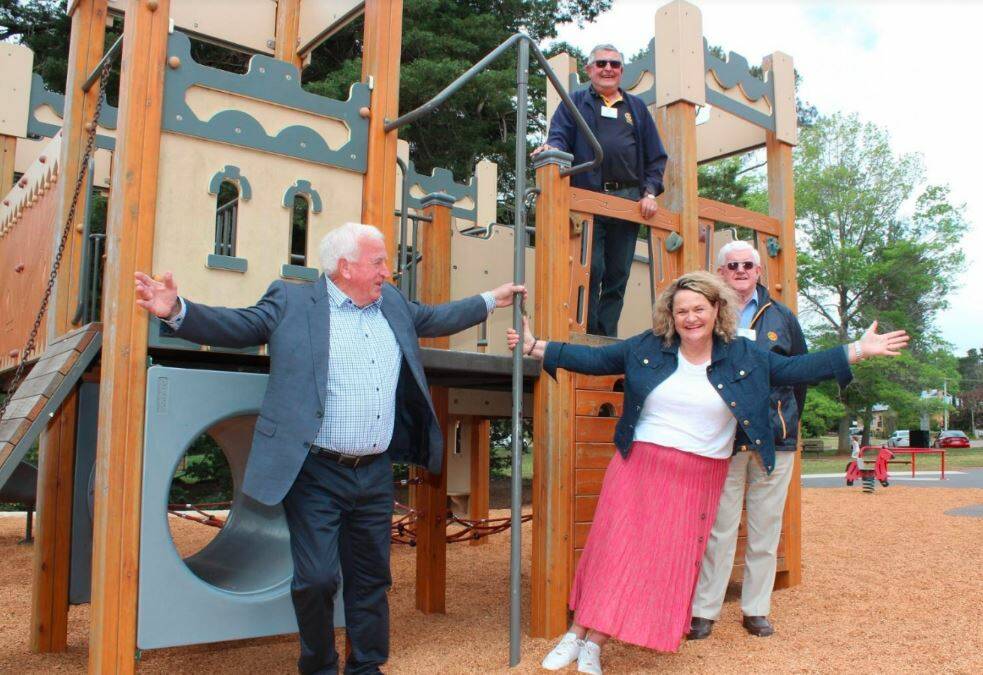 Big kids: Deputy Mayor Grahame Andrews, Derek White and John Macpherson from the Berrima District Rotary Clubs test the new play equipment with the Member for Goulburn, Wendy Tuckerman MP. Photo: supplied