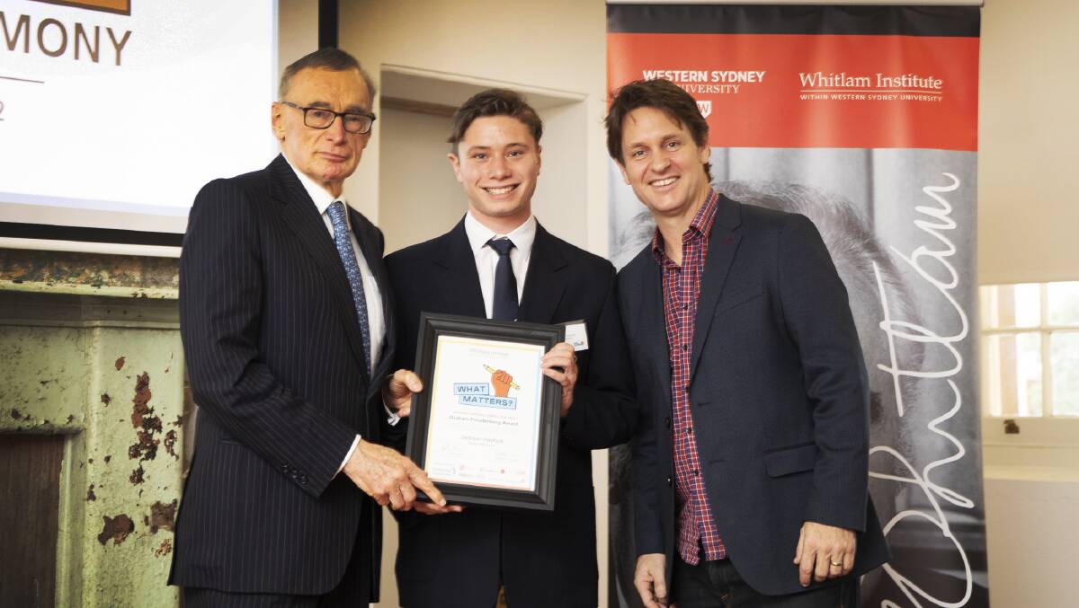 Jackson (centre) was presented with the award by competition winner and former Bowral High School student Craig Reucassel (right) and former NSW Premier Bob Carr (left). Picture supplied.