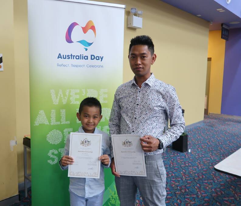 HAPPY: Linesh Gurung and his son Sazal were thrilled to call themselves Australians for the first time following the Australia Day ceremony.