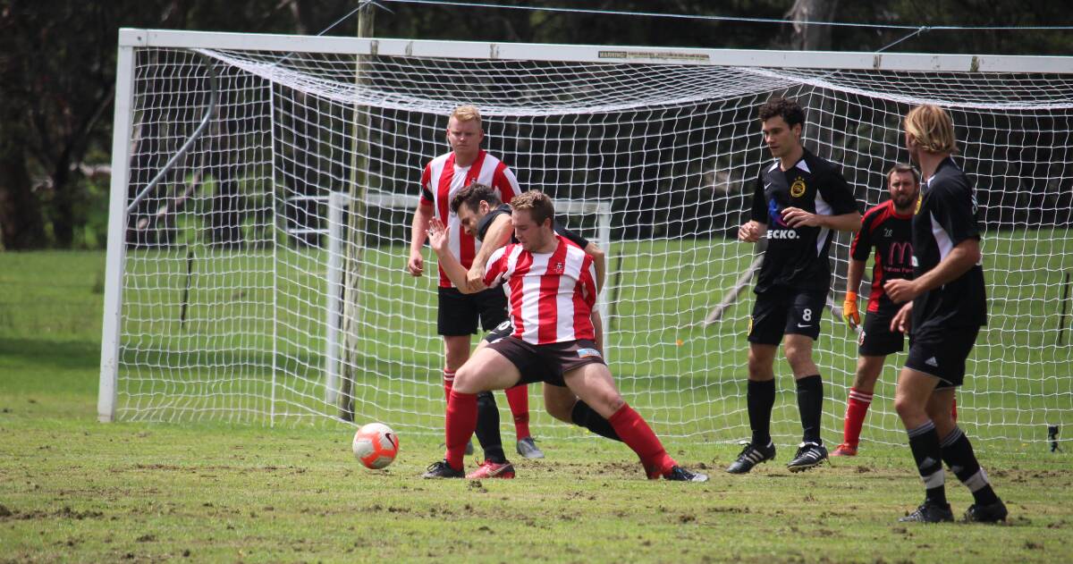 Kick for charity: Moss Vale Soccer Club took on UNSW Football Club in a charity game held at Ferndale Reserve, Bundanoon. Photo: Vera Demertzis.