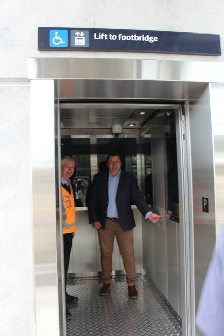 Going up: Nathaniel Smith and station manager Graeme Bond use the newly installed lift at Mittagong Station. Photo: Vera Demertzis