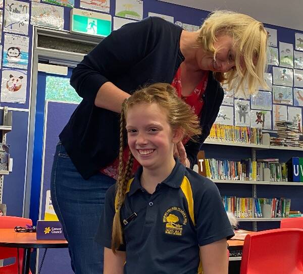 Got the chop: Samara chopped off her long hair to support her grandparents. Picture: Supplied.