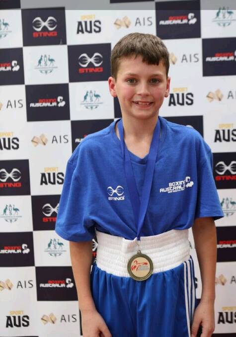 Wiiner Winner: Weighing just 34 kg and only 11 years old, Angus Holt was awarded gold as he was named as the u15 Australian Champion in Queensland. Photo: supplied. 