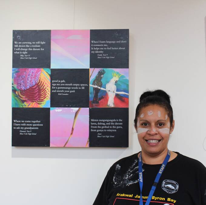 NAIDOC Week: Aboriginal community development officer Melissa Wiya stands in front the poetry created by students in the Gundungurra language which will be displayed on bus backs. Photo: Vera Demertzis. 
