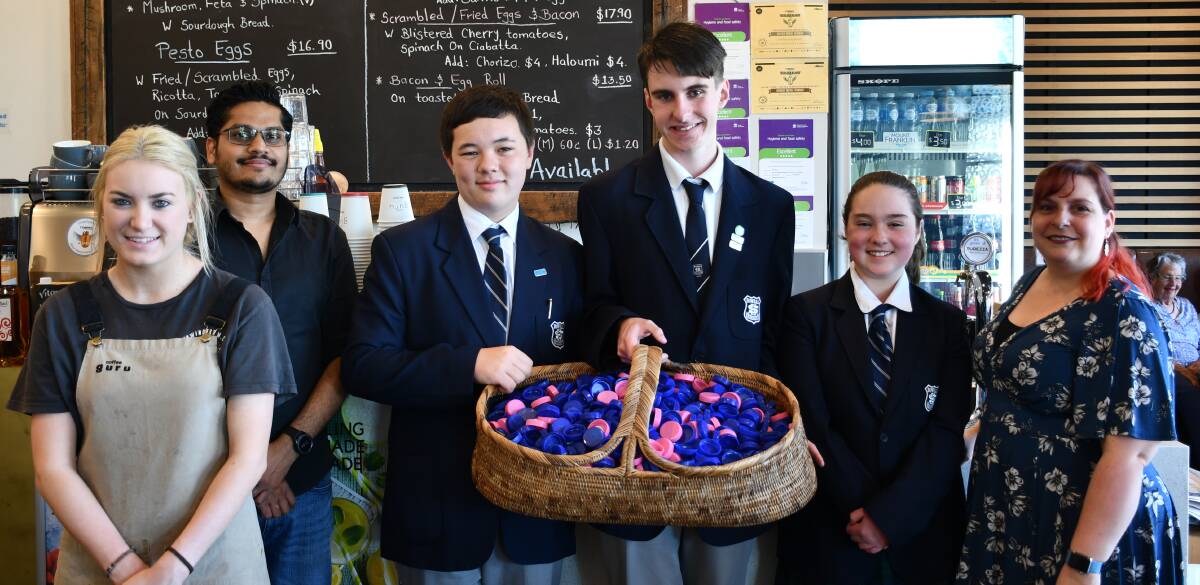 BOTTLED GOLD: Bowral High School students collected more than seven kilograms of bottle caps with help from The Coffee Guru and the Bowral CWA. Photo: Hannah Neale