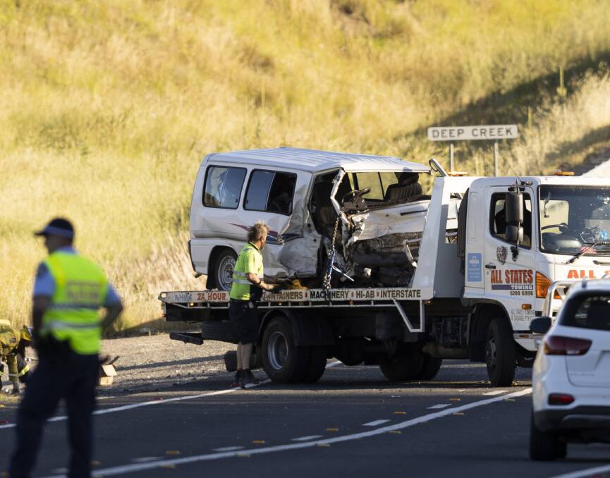 A white van is towed away after a crash on the Monaro Highway south of Canberra. Picture: Keegan Carroll