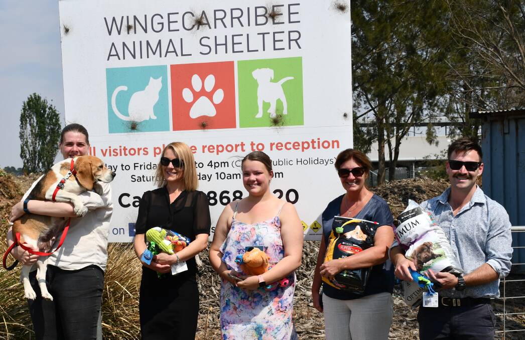 HELPING PAW: The Southern Highland News sales team presenting donations to the animal shelter. Photo: Hannah Neale