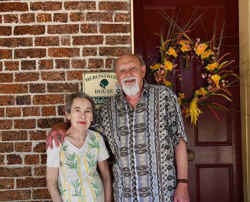 BED AND BREAKFAST: Tina and Brian Davis outside the front door of Heronswood House. Photo: Hannah Neale