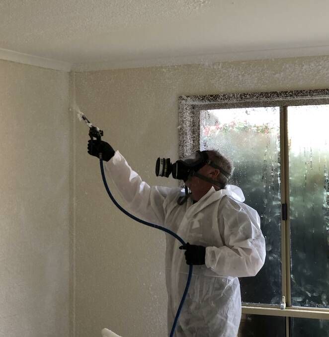 Bryan Norris in PPE applying chemical foam to decontaminate a property. Photo: Supplied