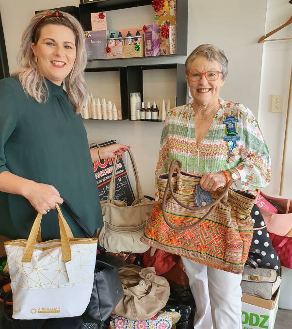 DONATION: Anyalee from Spoilt Hairdressing with Moss Vale Evening CWA member Jennifer Bowe. 