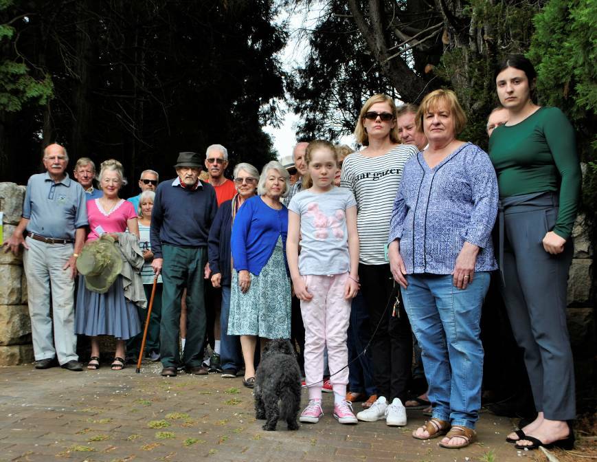 HERITAGE: Concerned residents outside a property on Aitken Road in December 2018. Members of the council voted to support the heritage listing of the area. Photo: File 